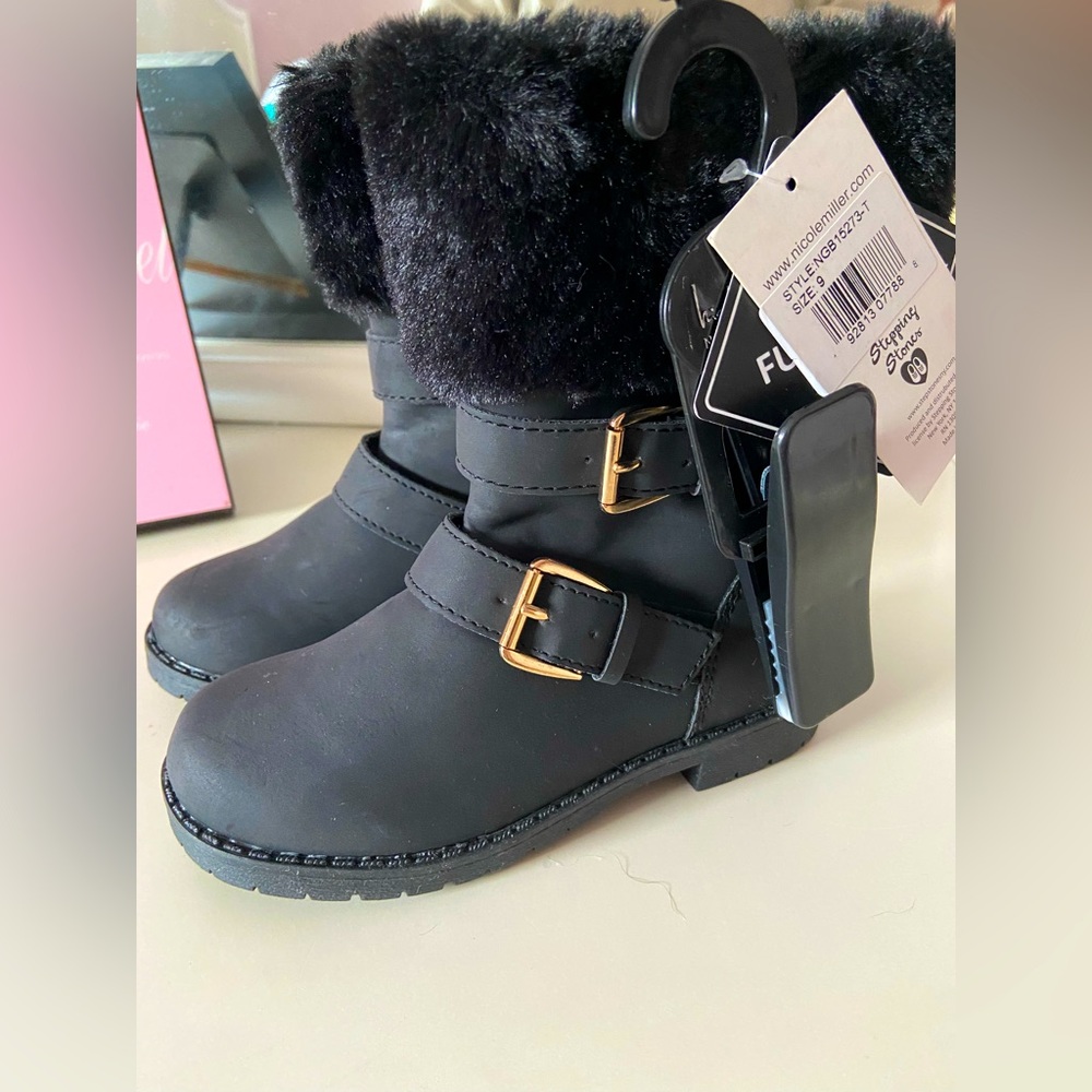 Toddler size nine winter boots. Never worn. With tags.